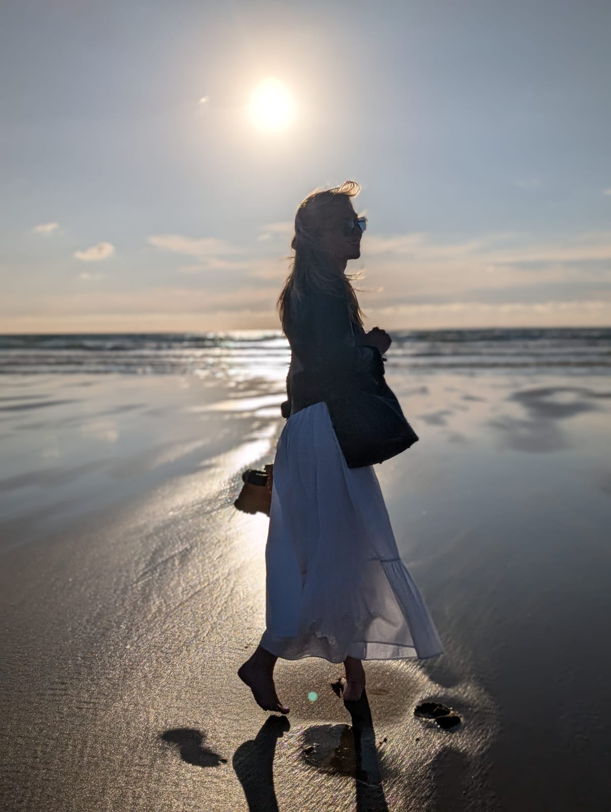 Emma walking beside the sea